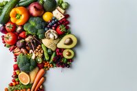 Fresh colorful vegetables and fruits arranged in border composition on light background. Healthy eating concept with seasonal produce for food photography and menu design.