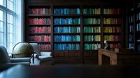 Elegant home library with colorful books organized by rainbow spectrum on wooden shelves, featuring vintage globe and reading desk by large windows.
