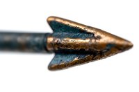 Macro shot of vintage copper arrowhead with patina showing weathered metal texture and sharp point detail against white background, isolated for design projects.