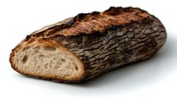 Rustic artisan bread loaf with dark charred crust and soft interior, designed to showcase authentic bakery products for food marketing and menu photography.