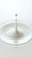 White milk drop creating splash with ripples on pure white background isolated for dairy and beverage design projects.