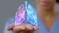 Glowing holographic lungs floating above open palm with vibrant blue and purple colors, depicting medical technology and respiratory health visualization.