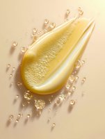 Luxurious golden cosmetic serum drop with bubbles on beige background, macro shot showing texture and transparency for skincare and beauty product advertising.