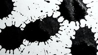 Monochrome ink splatter pattern with organic black and white shapes creating dynamic contrast and texture for design projects.