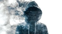 Mysterious hooded figure emerging from digital code and smoke effect, representing cyber security threat or hacker concept. Dark atmospheric composition for technology themes.