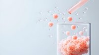 Pink effervescent powder dissolving in clear glass with floating bubbles and particles creating dynamic motion against light blue background. Supplement concept.