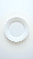 Empty white ceramic plate on neutral background for food photography and culinary presentations.