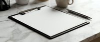 Empty clipboard with pen on marble desk surface for business planning and note-taking in modern office workspace environment.