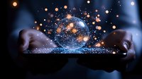 Magical glowing sphere with sparkles and light particles floating between hands against dark background, creating mystical energy effect for spiritual concept.