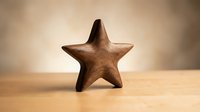 Wooden star decoration on natural wood surface with warm lighting for home decor and crafting projects.