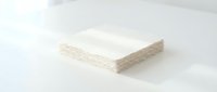 Stack of white paper napkins on clean surface for dining and hospitality use.