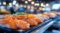 Fresh salmon nigiri sushi pieces garnished with herbs on black plate, selective focus with blurred restaurant lights background creating luxurious dining atmosphere.