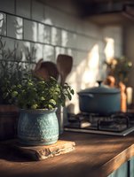 Fresh herbs in blue ceramic pot on wooden kitchen counter with gas stove and cookware in soft morning light.