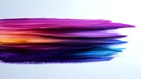 Abstract colorful brush strokes in vibrant purple, pink, orange and blue hues creating dynamic paint texture on white background for creative design.
