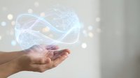 Digital holographic infinity symbol floating above open palm with glowing particles and light effects on neutral background for technology concepts.