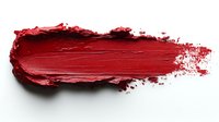 Red lipstick smear stroke isolated on white background. Cosmetic makeup texture for beauty and fashion design projects.