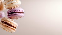 Colorful French macarons with cream filling stacked on soft pink background. Sweet pastry dessert cookies for bakery menu, cafe advertising and culinary projects.