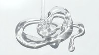 Clear liquid gel or transparent slime splashing and flowing in abstract shapes against white background, isolated for design use on packaging, cosmetics, skincare products, and digital media.