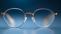 Stylish round sunglasses with rose gold metal frame and gradient blue lenses on dark blue background for fashion eyewear accessories and optical products.