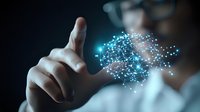 Asian male professional touching glowing network visualization with connected dots and lines, representing digital transformation and artificial intelligence technology.