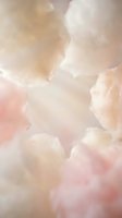 Soft pastel watercolor texture with blush pink and cream tones creating dreamy abstract background for wedding invitations and feminine designs.