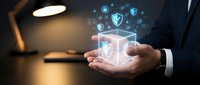 Businessman hands holding digital security shield with cyber protection icons and network connections in modern office environment.