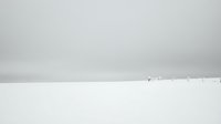 Minimalist winter landscape with snow-covered field and distant figures under overcast sky creating serene monochromatic scene for peaceful backgrounds.