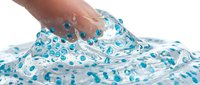 Hand stretching clear slime with blue glitter beads, sensory toy play and stress relief activity for children and adults.