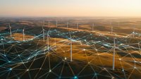 Wind turbines in rural landscape with digital network overlay representing renewable energy infrastructure and smart grid technology for sustainable power generation.