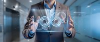 Professional businessman presenting digital infinity symbol with glowing effects and technological interface in modern office environment.