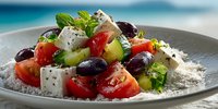 Fresh Greek salad with feta cheese, tomatoes, cucumbers, olives and herbs served on ceramic plate. Mediterranean cuisine dish for healthy eating and dining.