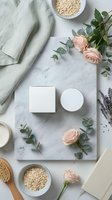Natural skincare cosmetics flat lay with pink roses eucalyptus and oatmeal on marble background for spa beauty wellness branding mockup design.