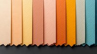 Torn colorful paper strips arranged in gradient from beige to turquoise creating modern geometric composition with rough edges and textured surface. Suitable for design backgrounds.