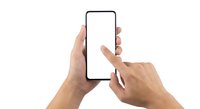 Hands holding smartphone with blank white screen, finger touching display for mobile app mockup and digital interface design projects.