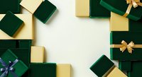Luxury gift boxes in emerald green and gold with decorative ribbons arranged on white background, perfect for holiday, celebration, and festive design projects.