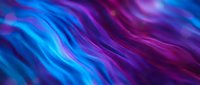 Abstract flowing waves in vibrant blue and purple colors creating dynamic motion background for modern digital design and creative projects.