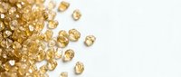 Sparkling golden yellow gemstones scattered on white background, luxury jewelry making materials for elegant accessories and precious stone collection.