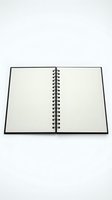 Open blank spiral notebook with empty pages on white background isolated for design and educational projects.