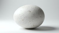 Speckled white egg with natural texture and subtle brown spots on neutral background, suitable for Easter designs, culinary content, and nature-themed projects.