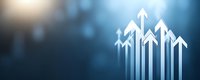 Glowing white arrows pointing upward against dark blue background with bokeh effect, symbolizing growth, success and forward momentum in business.
