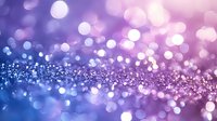 Magical glowing bokeh background with purple and blue gradient colors, sparkling glitter particles creating dreamy atmospheric effect. For festive designs.