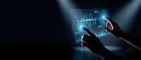Hands interacting with glowing digital financial charts and graphs on transparent screen in dark environment for business analytics.