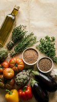 Mediterranean diet ingredients with olive oil, fresh herbs, vegetables and legumes on rustic background for healthy cooking and nutrition concepts.