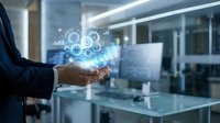 Businessman holding holographic digital technology interface with glowing data visualization and network connections in modern office environment.