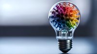 Colorful rainbow tree growing inside light bulb against blurred background, creative concept of innovation, growth and bright ideas for business solutions.