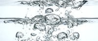 Clear water with bubbles and splashes isolated on white background, suitable for beverage, wellness, and design projects.