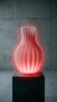 Modern illuminated vase with red LED lighting on black pedestal against concrete wall for contemporary interior design and home decor concepts.
