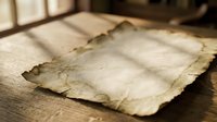 Vintage aged parchment paper with burnt edges lying on wooden surface. Ancient manuscript texture for historical documents, antique letters, treasure maps.