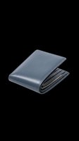 Slate blue leather bifold wallet isolated on transparent background, ready for e-commerce, product mockups, t-shirt designs, stickers, and print-on-demand applications.