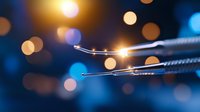 Macro shot of fiber optic cables with glowing light trails and bokeh effect against dark blue background, showcasing modern telecommunications technology.